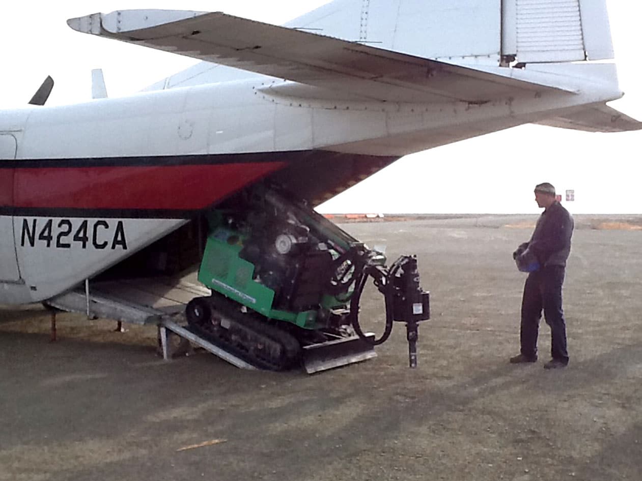 EM1 model unloading off an airplane.