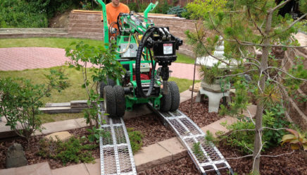 R2 model manuevering through a garden.